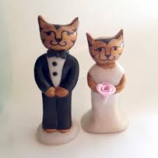 The bride is wearing a pretty light blue glittered bridal veil, which is decorated with blue and white beads. How To Find The Funny Cat Wedding Cake Toppers In Ten Seconds Custom Wedding Cake Toppers