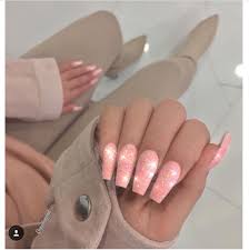 Peach acrylic nail design, this acrylic nail design has a peach background, and black and white dots. Poppin Peach Glitter Nails Peach Acrylic Nails Shiny Nails Designs Peach Nails