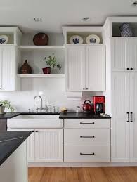 Place these two pieces of wood over the 2x4s above the sides of your cabinet. Home Dzine Kitchen Use The Space On Top Of Kitchen Cabinets