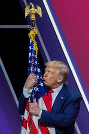 The Independent - Donald Trump hugged and kissed a flagpole during a  bizarre speech at CPAC in Maryland. "I love you baby," Mr Trump told the flag  as he held tight to