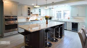 Warm, off white tile and cream walls brighten up small sections of the room. Light Grey Kitchen With Dark Grey Island Cabinets Omega