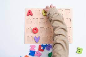Bird Eye View Of Preschooler Kindergarten Boy Playing With Alphabet Blocks Children Learning English With Wooden Edu Kids Learning Learn English Boys Playing