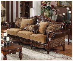 The watermarks, stains, rips and worn spots are beyond recovery; Wood Frame Couch With Removable Cushions