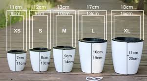 All specifications are subject to change without notice. Self Watering Flower Pot Tumble Cat
