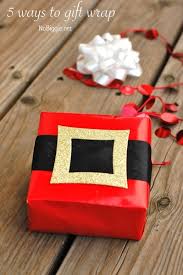 Use scissors to cut paper along one side, making a wide enough sheet to cover both sides of the box. 30 Christmas Wrapping Ideas Nobiggie