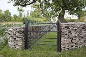After laying out the marker extension cord, it's time to dig out the trench. Hardscaping 101 Dry Stone Walls Gardenista