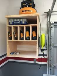 Large wheels and a rubber grip also make the compressor portable if you want to move it around the garage or outside. Air Compressor Cabinet Storage Garage Storage Organization Woodworking Storage