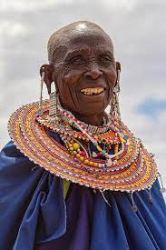 They automatically fall into the age group of their husband. Maasai Woman In Tanzania Photograph By Kay Brewer
