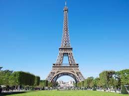 The eiffel tower is a wrought iron tower that stands 1,063 ft (324 m) tall. Eiffel Tower Facts And History