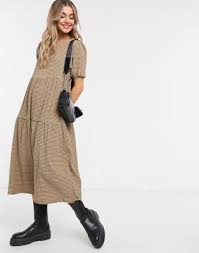 Asos pleated midi skirts first appeared on chictopia's streetstyle gallery in spring 2012 seen on denver blogger nopantstuesday of angiekje gave asos skirts a rating of 5 stars and said: Asos Design Midi Tiered Smock Dress In Camel And Black Grid Print Asos