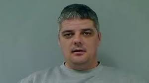 Prison head apologises for murder suspect's release