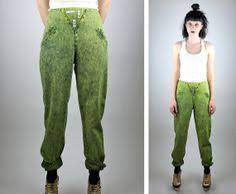 Orange tab acid wash jeans with a fitted high waist and zip fly. Colored Acid Wash