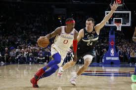 Philadelphia 76ers shooting guard seth curry suffered a left ankle sprain against the milwaukee bucks and did not return. Embiid Stars As 76ers Beat Bucks 121 109 Wtop
