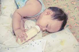 Asian Baby Sleeping And Drinking Milk From The Bottle Stock Photo By C Viiwee 87651476