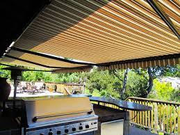 Keeping The Outdoor Barbecue And Kitchen Cool With These Large Retractable Awnings Fabric By Sunbrella Retractable Awning Patio Patio Awning Outdoor Barbecue