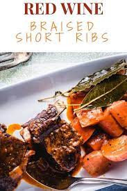 A Delicious Braised Short Rib Dish Cooked In Red Wine And Beef Stock With Root Vegetables Beef Recipe D Pork And Beef Recipe Beef Recipes Slow Cooked Beef