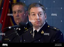 Inspector Keith Finn (right) of the RCMP's Integrated National Security  Enforcement Team (INSET) stands with Superintendent Tom Fitzgerald of the  Toronto Police Service during a press conference in Toronto