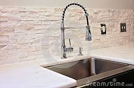 Modern Kitchen Detail Sink Marble Counter Stacked Stone Back Splash Industrial Spray Faucet Stacked Stone Backsplash Stone Backsplash Stone Backsplash Kitchen