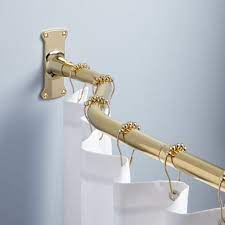 Brass curtain rods are a great choice for this room because they relate to all the varying gold tones in the living room decor and accessories. Brushed Gold Shower Curtain Rings Gold Shower Curtain Shower Curtain Rods Curtain Rods