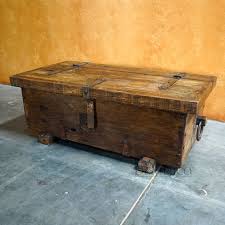 The wooden coffee table has a large interior storage compartment for clothes, books, magazines, and anything else you'd like to keep within reach but out of sight. Troje Trunk Coffee Table Storage Coffee Table Old Wood Coffee Table