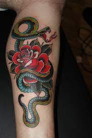 Thigh snake in flowers tattoo. Traditional Snake With Rose Tattoo On Right Leg Calf