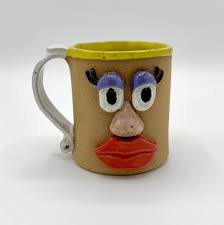 I made these mugs with Mayco stroke and coat glazes. The body of the clay  was left natural.