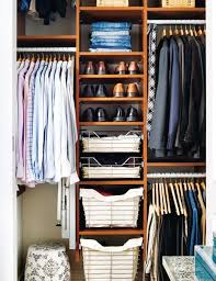 Open shelf organizers allow air to circulate and also make better use of the available floor space below the long hanging section of clothes. Small Space Mens Closet Small Novocom Top