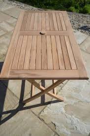 A garden table can have as many uses as you have things to put on it. Warwick Rectangular 1 2m Teak Folding Garden Table And Outdoor Living Field Hawken