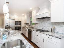 To create the illusion of a small space being bigger, stick to a monochromatic color palette. White Marble Kitchen Ideas Beautiful Designs Designing Idea