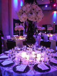 Here the vibrant green, red, and purple hues of the flowers are off set against a in wedding table decorations. Black And Purple Wedding Theme Wedding Reception Party Ideas Party Decor And Desi Purple Wedding Decorations Purple Wedding Theme Purple Wedding Reception