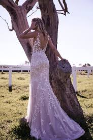 This lace and soft crepe combination from essense of australia perfectly captures the cleanliness of modern style and romance of a classic wedding day. The Harper Moira Hughes Couture Wedding Dresses Sydney