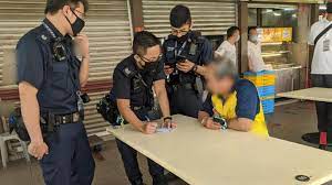 A safe distancing enforcement officer patrols a singapore pools outlet. Covid 19 Police Investigating 12 Reports Of Abuse Against Enforcement Officers Safe Distancing Ambassadors Today