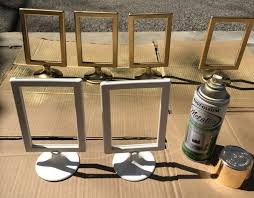 Diy Gold Table Number Holders Using 0 99 Ikea Tolsby Frames Angelahums Ikea Tolsby Frame Gold Spray Paint Diy Gold Diy