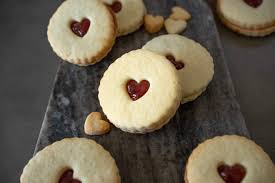 Measure out dough in teaspoonfuls, roll in nuts and place on a greased cookie sheet. Jammie Dodgers Cookies