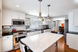 Cherry Hill Nj This Expanded Kitchen Has Black Granite Countertops Which Work Well With The White Cab Black Granite Countertops Cool Kitchens White Cabinetry