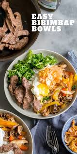 Flank Steak And Colorful Vegetables Are Served Over Rice In This Easy Korean Bibimbap Bowl Koreanfood Bibimbap Beef Riceb Recipes Beef Recipes Food Dishes