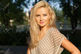 Going blonde a guide for asian hair hair com uk. Portrait Of Beautiful Young Woman With Blonde Hair And Blue Eyes In Park Stock Photo Picture And Royalty Free Image Image 17725519