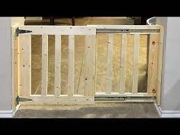 Diy Dog Gates Can Keep Your Dog Safely Isolated And Out Of Trouble While Giving More Space To Roam Than A Crate Diy Dog Gate Wood Baby Gate Barn Door Baby