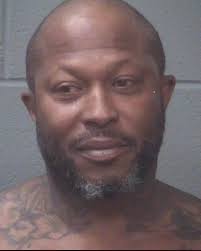 Man charged with strangling woman