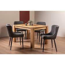 Light oak pick up a selection of dining chairs to perfect the style and look of your home. Blake Light Oak 4 6 Seater Dining Table 4 Cezanne Dark Grey Faux Leather Chairs With Sand Black Powder Coated Legs Dining Sets Home Origins