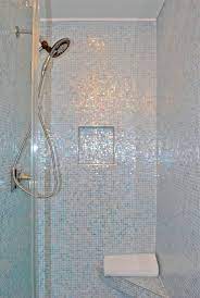 We tiled our bathroom shower with white subway tiles and you can too! Glass Mosaic Shower Mosaic Shower Mosaic Shower Tile Shower Tile