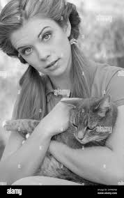 Girl holding cat Black and White Stock Photos & Images