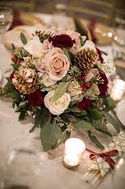 We've rounded up the most unique wedding flowers ideas that'll set your big day apart. Warm December Wedding At The Embassy Suites Flower Centerpieces Wedding Winter Wedding Flowers Christmas Wedding Flowers