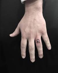 Leo Zodiac Sign Tattoo On The Ring Finger Leo Finger Tattoo Ring Finger Tattoos Small Finger Tattoos