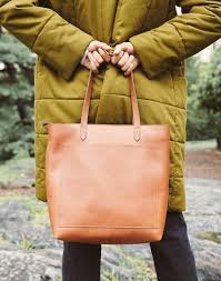 All kinds of good stuff—a pouch, a post wallet, your phone, the works. Parity Madewell Zip Top Transport Tote Up To 75 Off