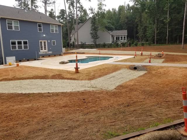 Drainage grading directing water away from problem areas