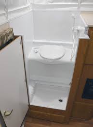 Queen bed with surrounding outlets and light switches. Picking The Perfect Truck Camper Truck Camper Magazine