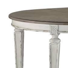 Signature Design By Ashley Realyn Round To Oval Dining Room Extension Table In Chipped White Table Only Nebraska Furniture Mart