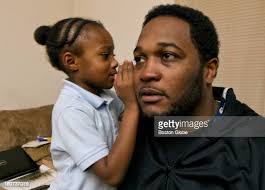 Sanai Saint-Pierre whispers something into the ear of her father,... News  Photo