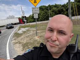 Officer McGinnis disapproves. Once again we have a semi truck stuck